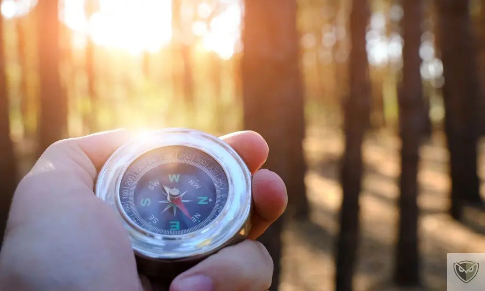 Tactical watch, compass, and binoculars: essential for navigating while hiking.